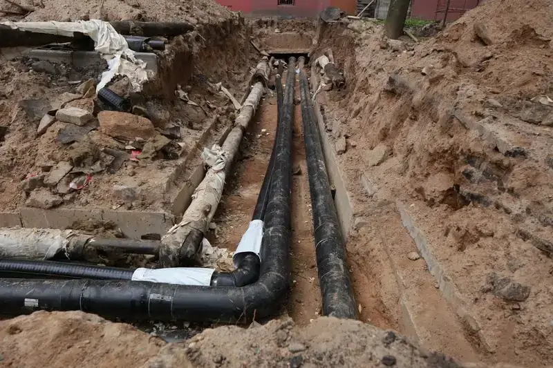 exposed sewer pipe excavation